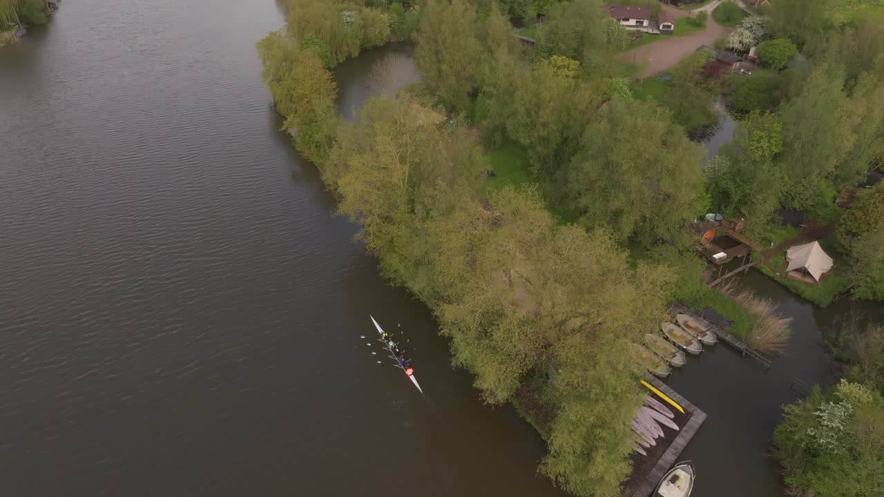 Single scull on calm Linge River in Heukelum, Netherlands