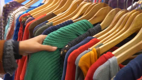 woman shopping for clothes at a clothing store