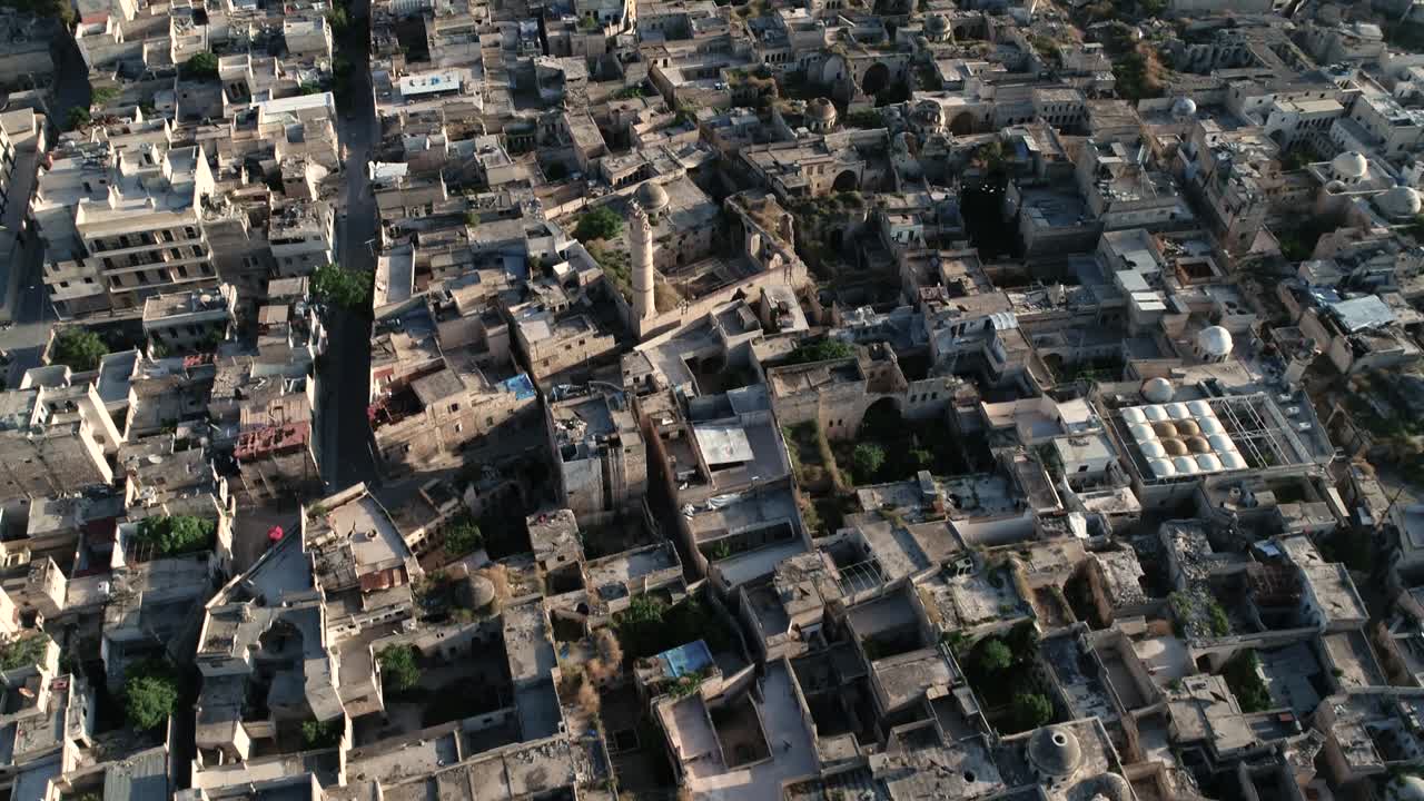 Rooftops of a district of Aleppo. We can see the roofs of the buildings of the Syrian city under the sunlight - aerial view 4K
