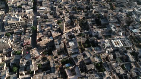 rooftops of a district of aleppo. we can see the roofs of the buildings of the syrian city under the sunlight - aerial view 4k