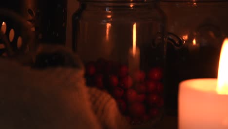 Relaxing-background-detail-shot-of-an-herbal-tea-shop,-with-candles-with-flickering-flames,-herbs,-small-bags-and-jars,-with-some-dust-flying-around