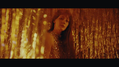 woman in gold sequin dress