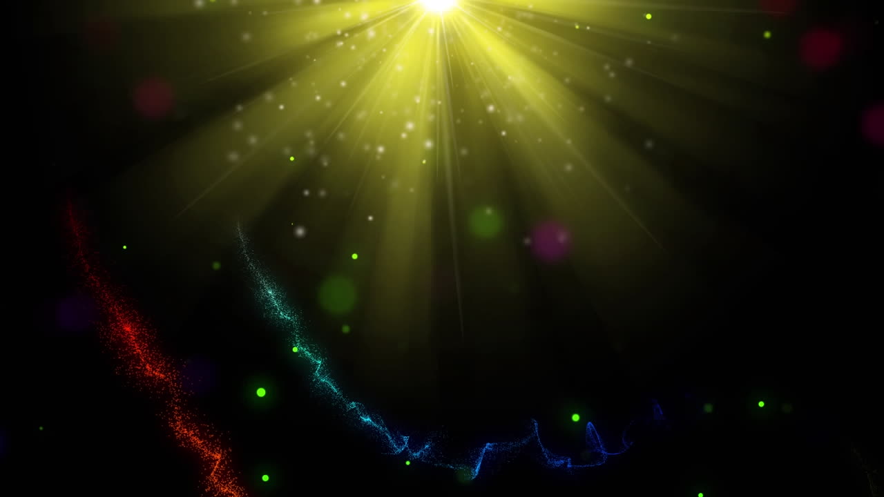 animación de coloridos senderos de luces navideñas y nieve sobre focos amarillos sobre fondo negro.