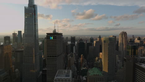 Slider-of-high-rise-buildings-in-midtown.-Aerial-footage-of-city-development-at-twilight.-Manhattan,-New-York-City,-USA