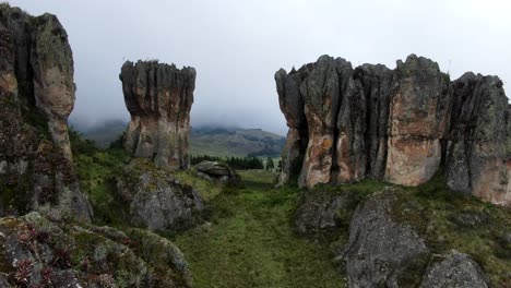 los frailones rock formations on the green plains at the hill of cumbemayo in cajamarca, peru