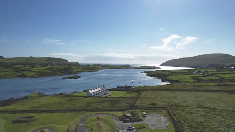 a 4k drone short of coastguard cottages on valencia island towards the atlantic ocean westwards