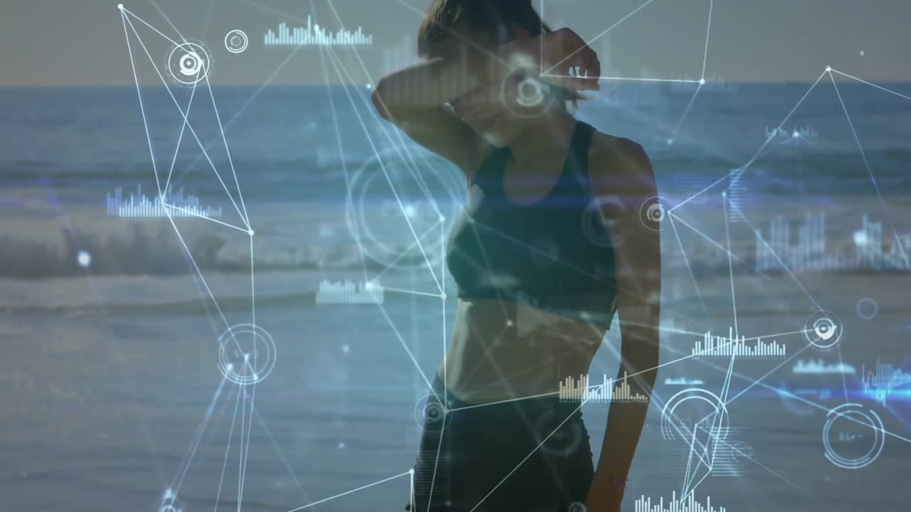 fitness data charts fading across shoreline, athletic woman shifting stance and scanning horizon