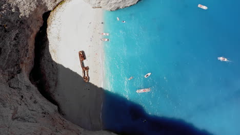 Aerial-top-down-view-of-the-Navagio-beach-with-the-famous-wrecked-ship-in-Zakynthos,-Greece