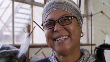 Mixed-race-woman-working-at-a-hat-factory