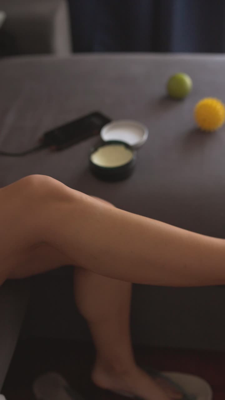 Applying cream to legs