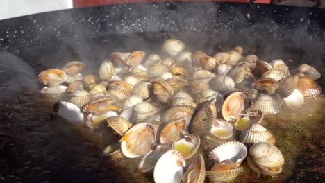 Preparing-delicious-paella-with-seafood,-typical-dish-of-Valencian-cuisine