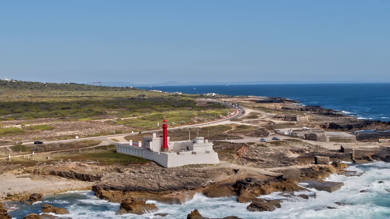 Coastline view with lighthouse and road in Portugal during daytime