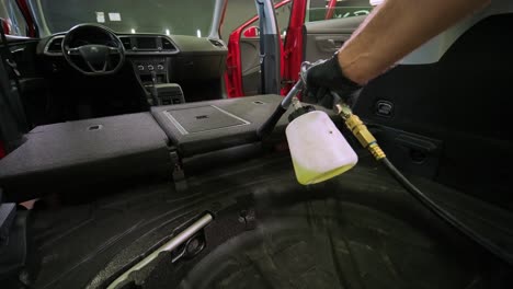 professional car cleaning. сar wash. interior detailing. dry clean and detail a car interior. deep seats cleaning. wiping foam in car wash. cleaning the car panel from dust. a vacuum cleaner