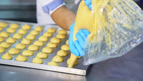 making cream puffs in a commercial kitchen