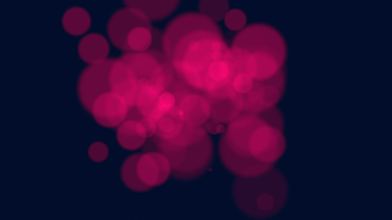 partículas rojas grandes y bokeh redondo en fondo oscuro