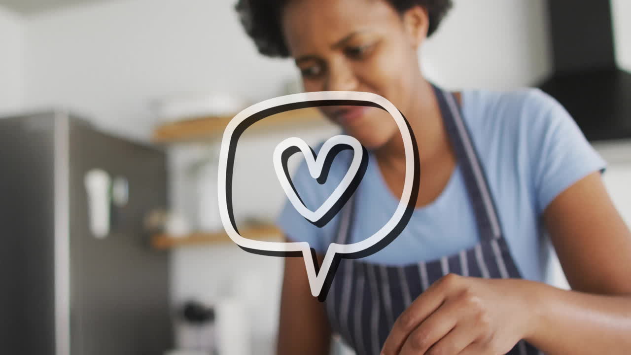 Person in striped apron cooking with heart symbol animation overlay
