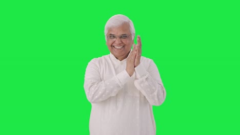 Happy-Indian-old-man-clapping-and-appreciating-someone-Green-screen