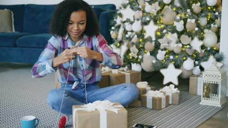 teenager wrapping christmas presents