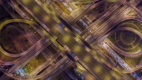 aerial hyperlapse of traffic over big intersection bridges and ring road. 4k aerial view by a drone over big roundabout in bangkok thailand.