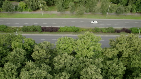 Aerial-view-of-roads-in-city-of-Warsaw-adorned-with-lush-green-trees