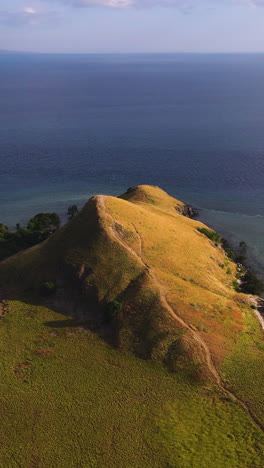 vertical shot of hill in kenawa island, sumbawa, indonesia