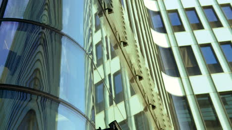 abstract reflections on glass façade of modern high-rise buildings