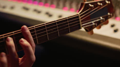 artist composer creating a new song on his electro guitar in studio