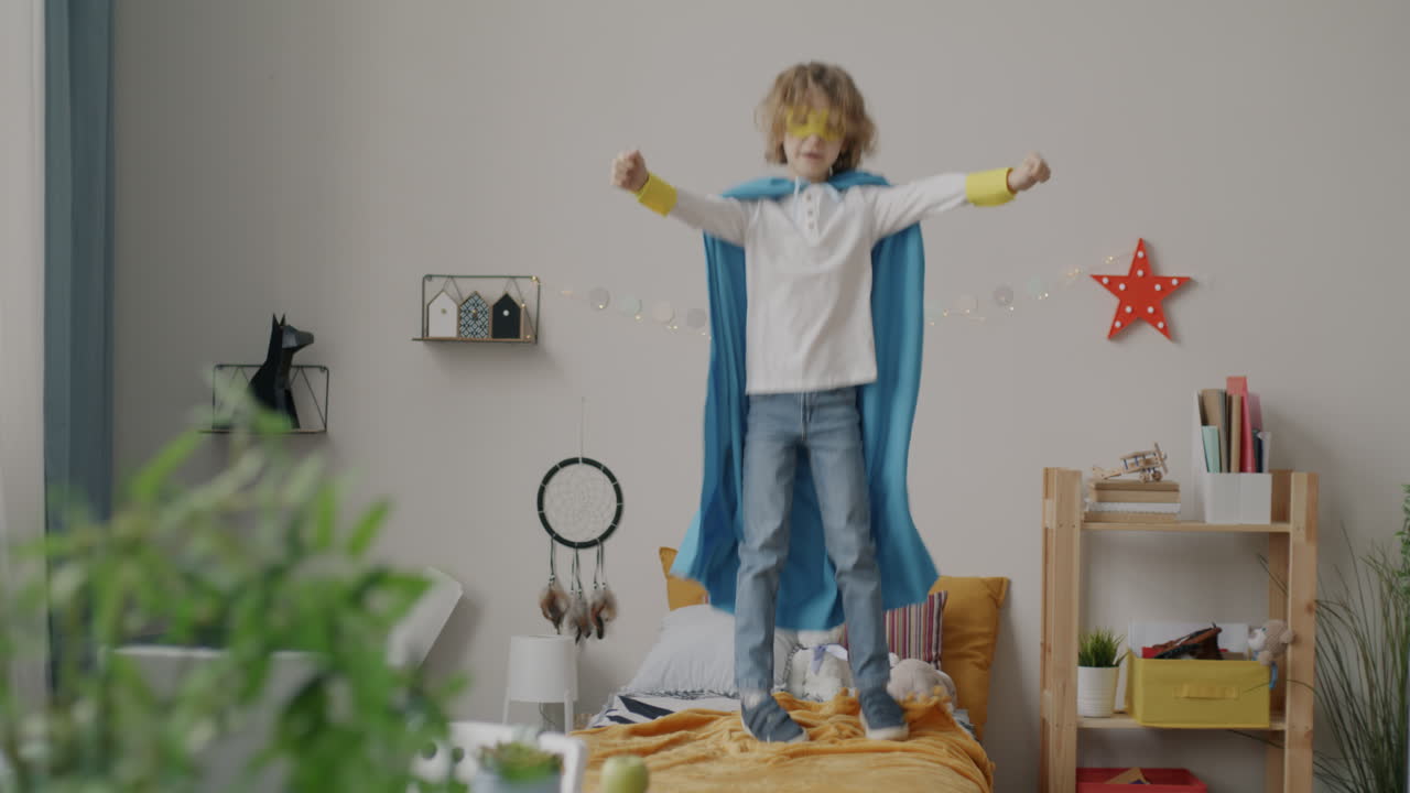 Child Playing Superhero in Bedroom