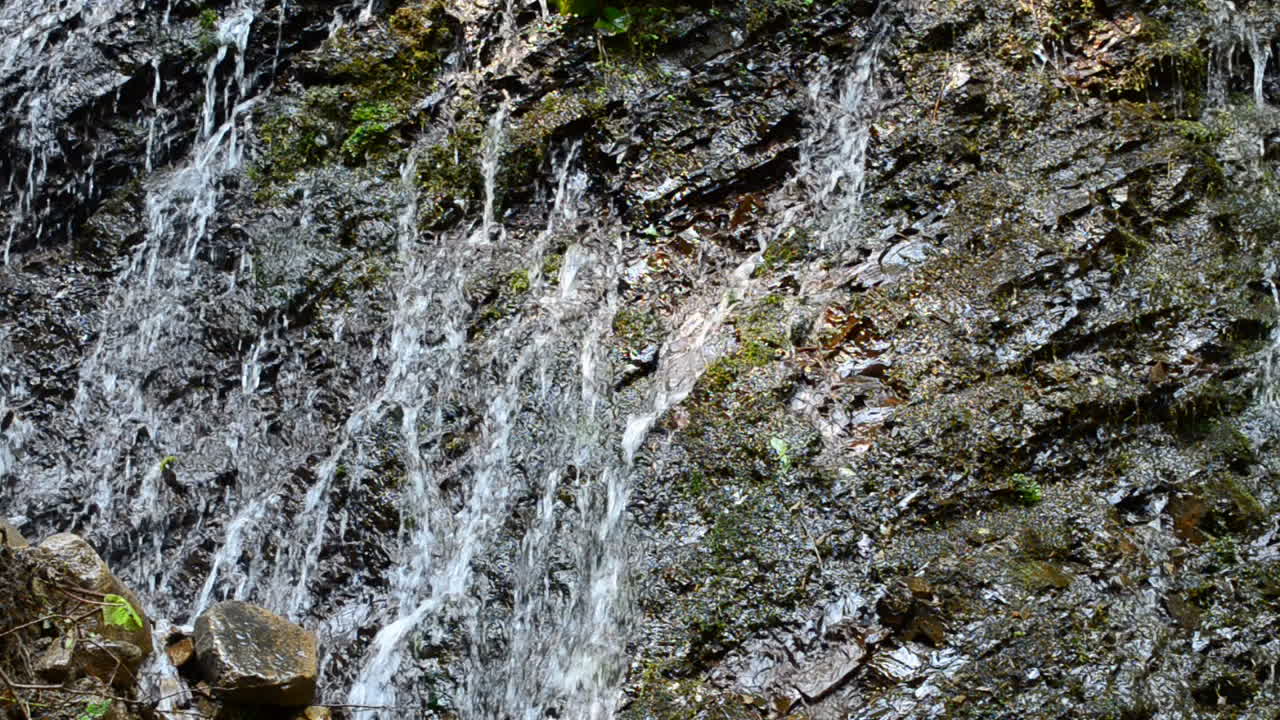 Water streams of falls and rock. Falls in mountains