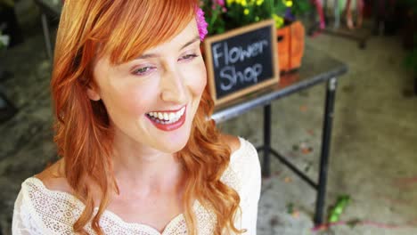 beautiful female florist in flower shop