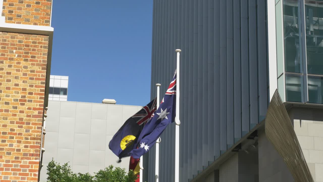Three Australian flags waving in the wind