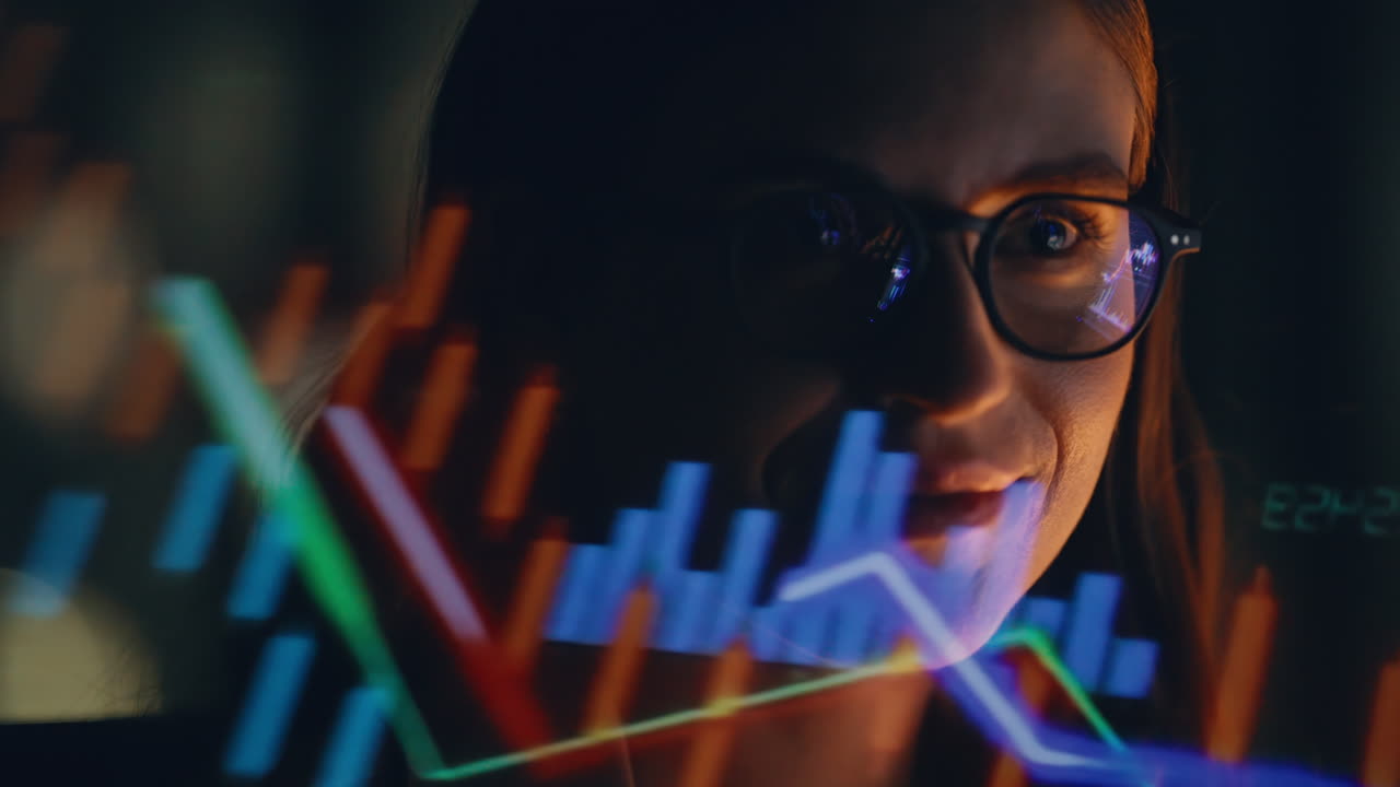 Night woman charts reflection wearing eyeglasses looking computer screen closeup