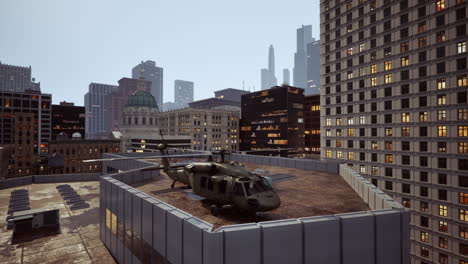 military helicopter on rooftop of skyscrapers at night