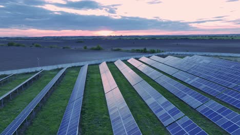 golden hour aerial over solar power plant - clean fuel production with zero emissions