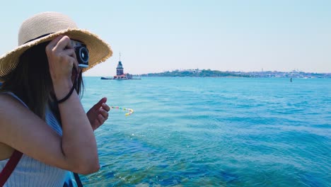 slow motion:beautiful girl takes pictures of bosphorus,a popular destination in uskudar town,istanbul,turkey