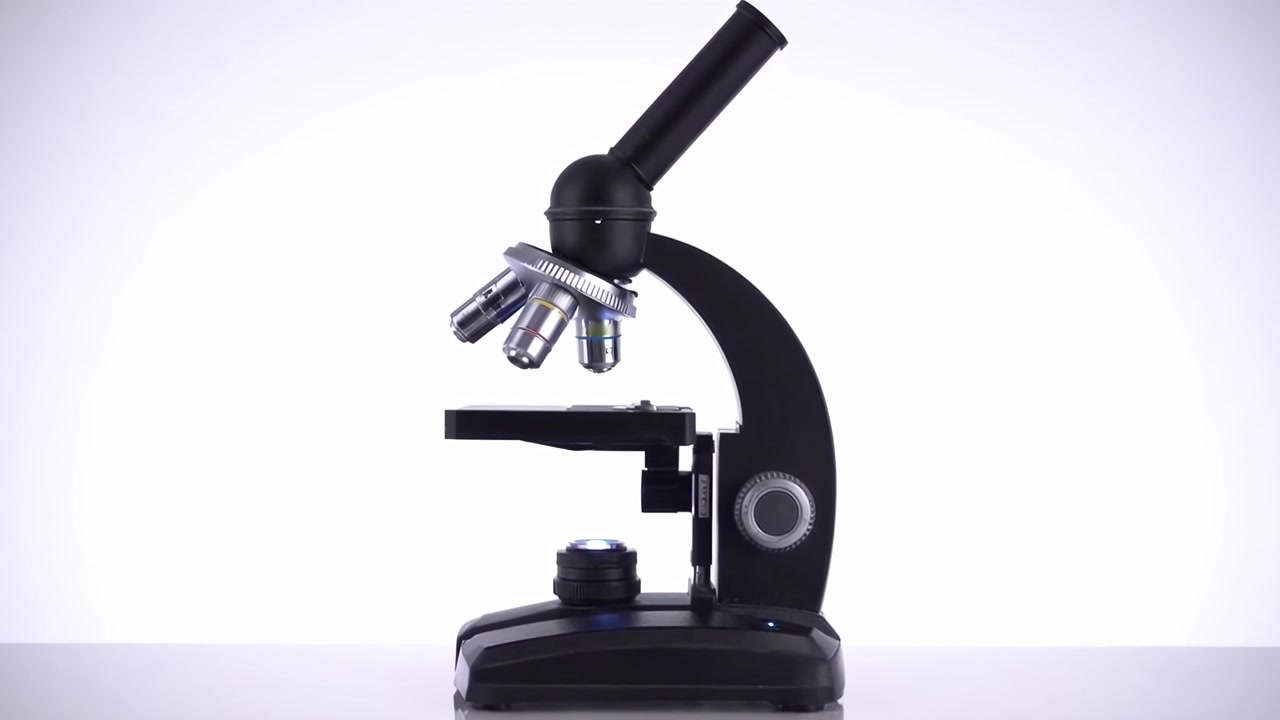 Detailed View of a Laboratory Microscope on a White Background
