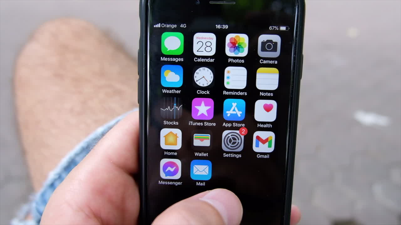 Chisinau, Moldova - July 28, 2021: Close up of a man opening up a financial tracking app displaying stock prices