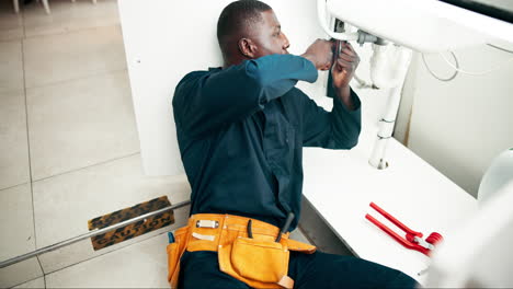 plumber repairing sink