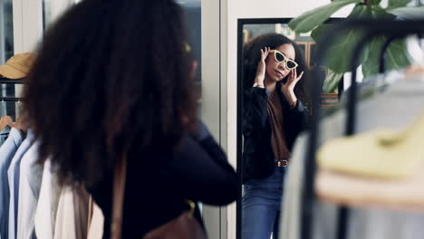 woman, store and fitting sunglasses in mirror