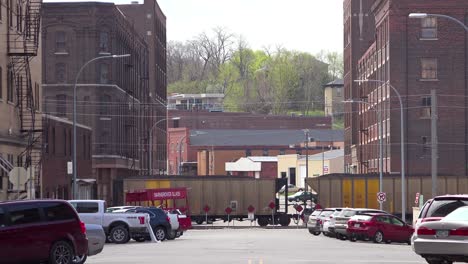 Establishing-shot-of-a-coal-town-with-freight-train-rolling-through