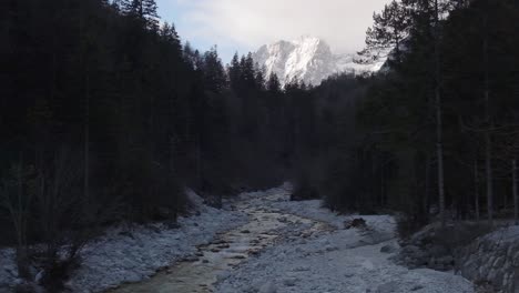 Stunning-frozen-waterfall-icicles-on-rocky-mountain-cliff-on-a-winter-day