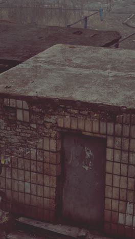 old abandoned brick building with metal door