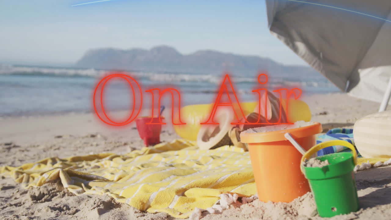 Colorful sand toys with On Air animation on beach scene with blue sky