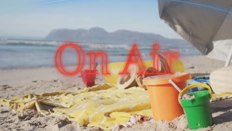 colorful sand toys with on air animation on beach scene with blue sky