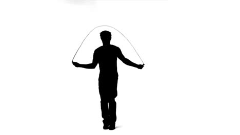 silhouette of a man skipping