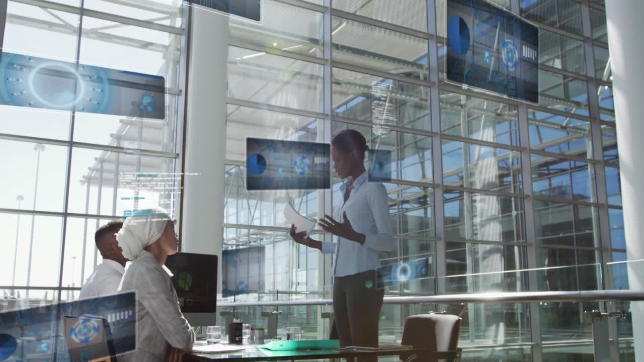 Animation of sonar, graphs, computer language over diverse coworkers discussing reports on desktop