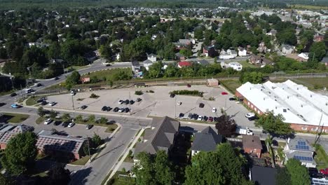 drone flying over train station in suburban acton neighborhood