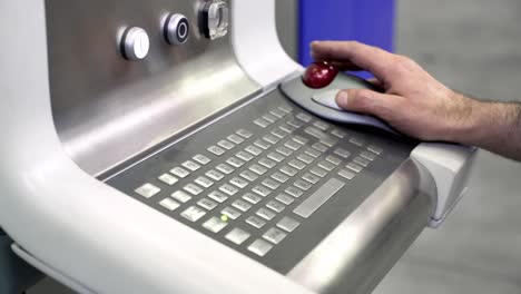 operator interacting with a cnc machine control panel