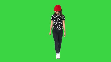 cute asian girl walking and looking at her feet on a green screen, chroma key