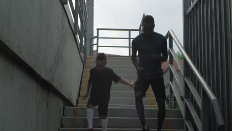 father and son running upstairs